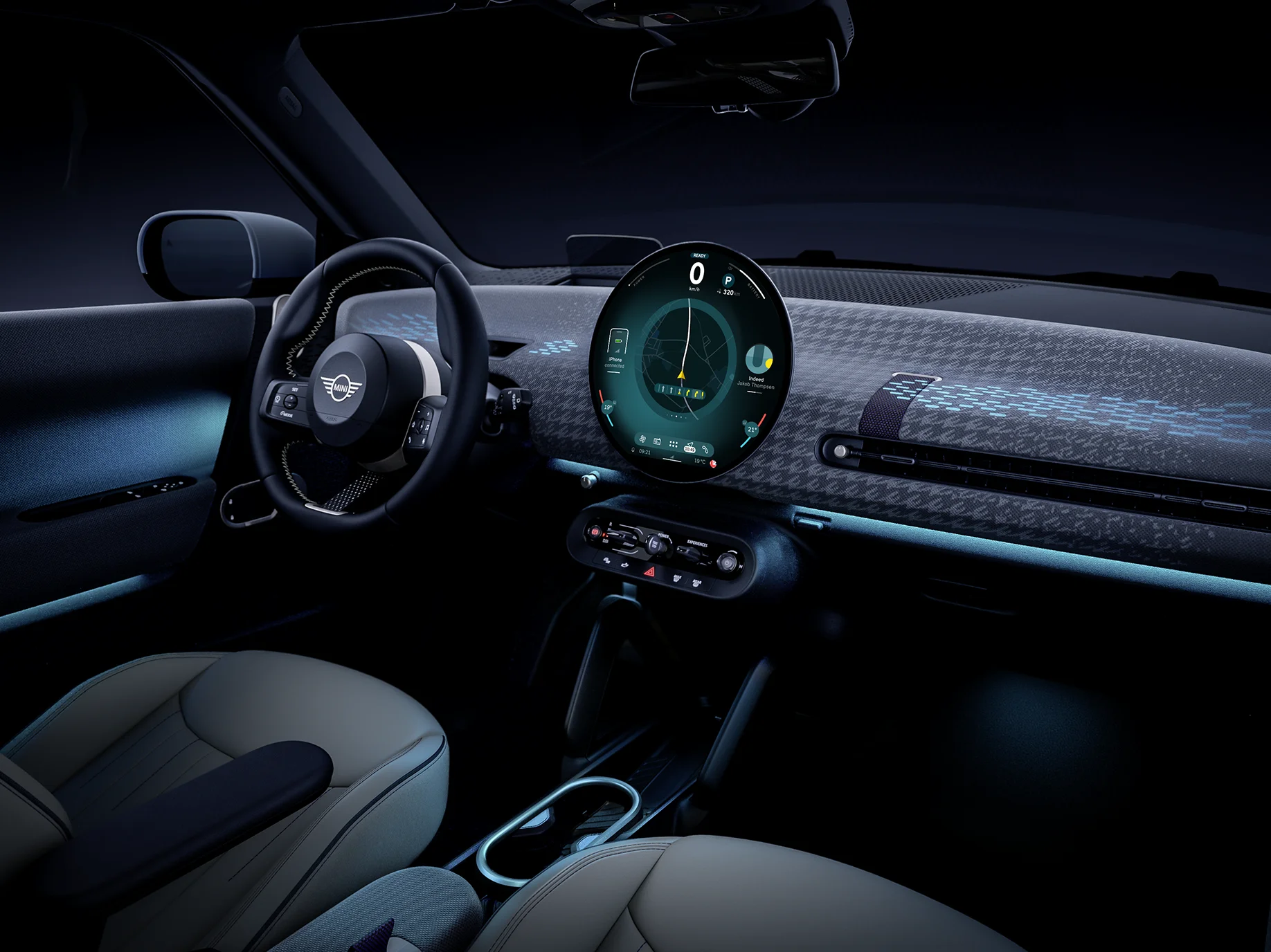Interior view of the all-electric MINI Cooper with ambient light in blue.