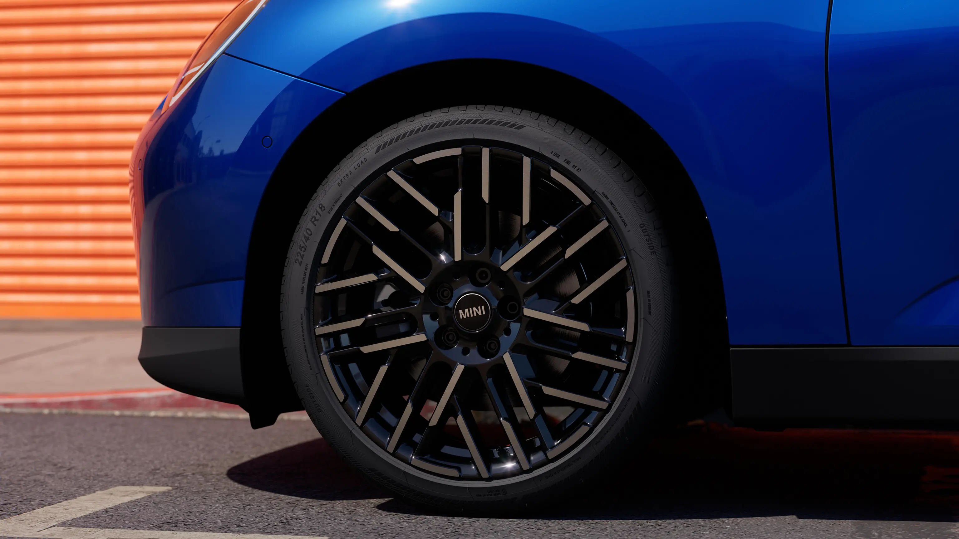 View of Night Flash Spoke Rim on a Blazing Blue  all-electric MINI Cooper